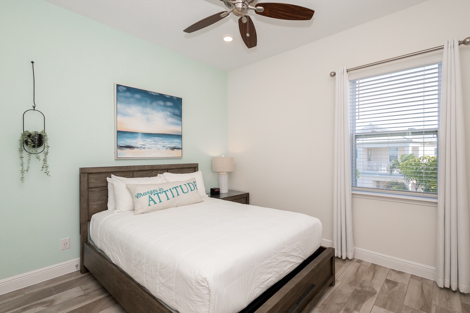 The beachy 2nd floor queen bedroom includes & Smart TV & organized closet