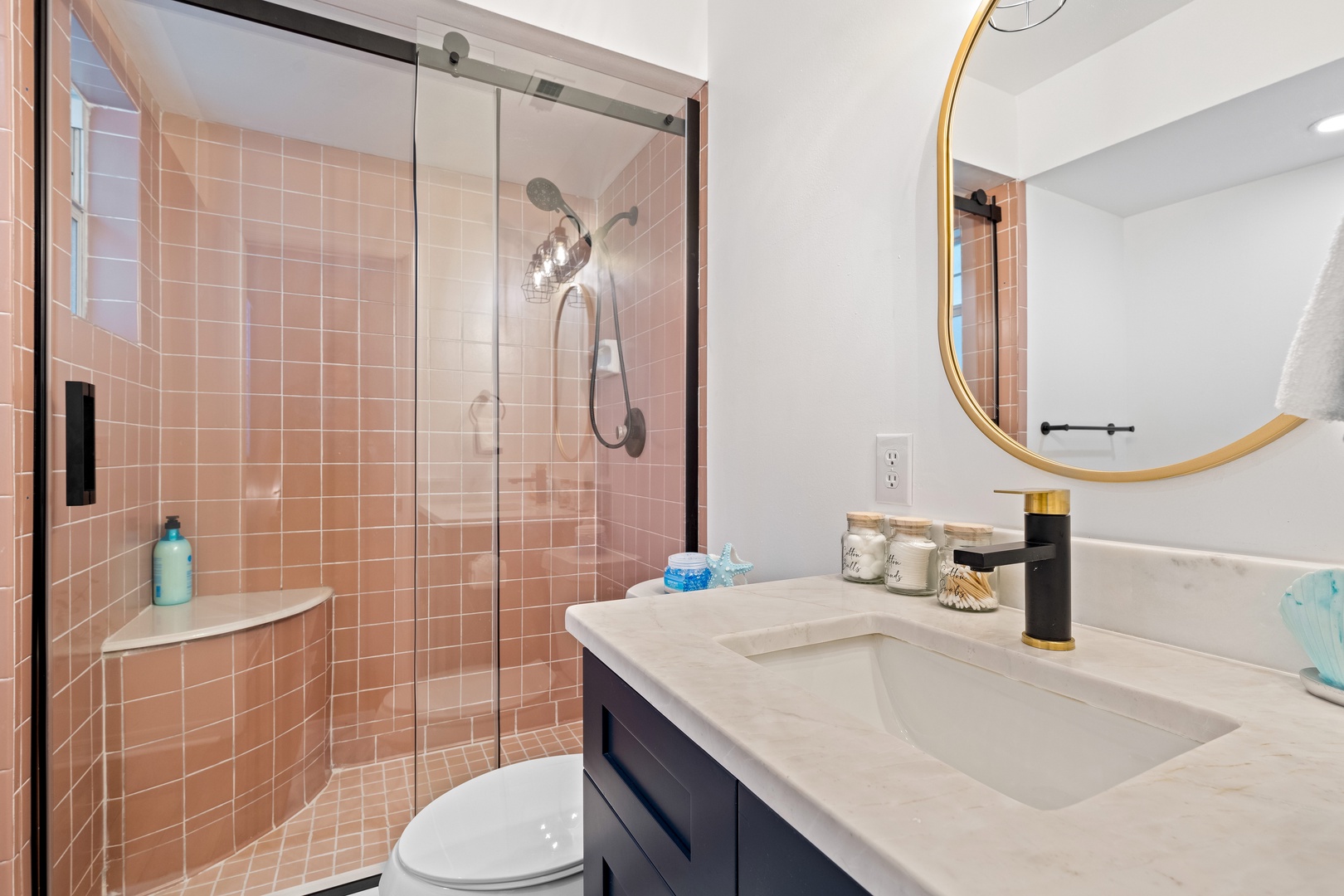 Enjoy ensuite luxury with chic single vanity and inviting glass shower