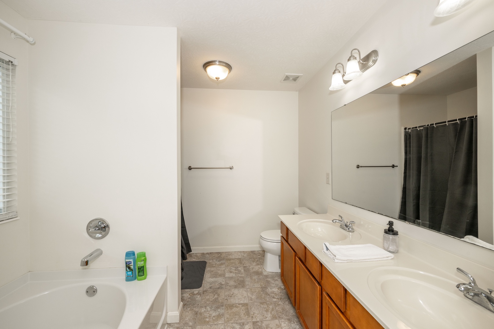 A double vanity, shower, & soaking tub is available in the king ensuite