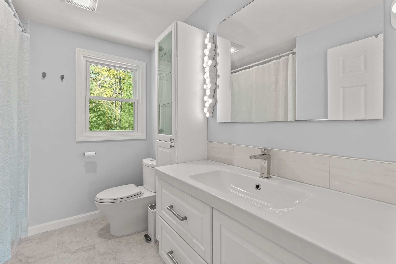 The full bath on the second floor offers a large vanity & shower/tub combo