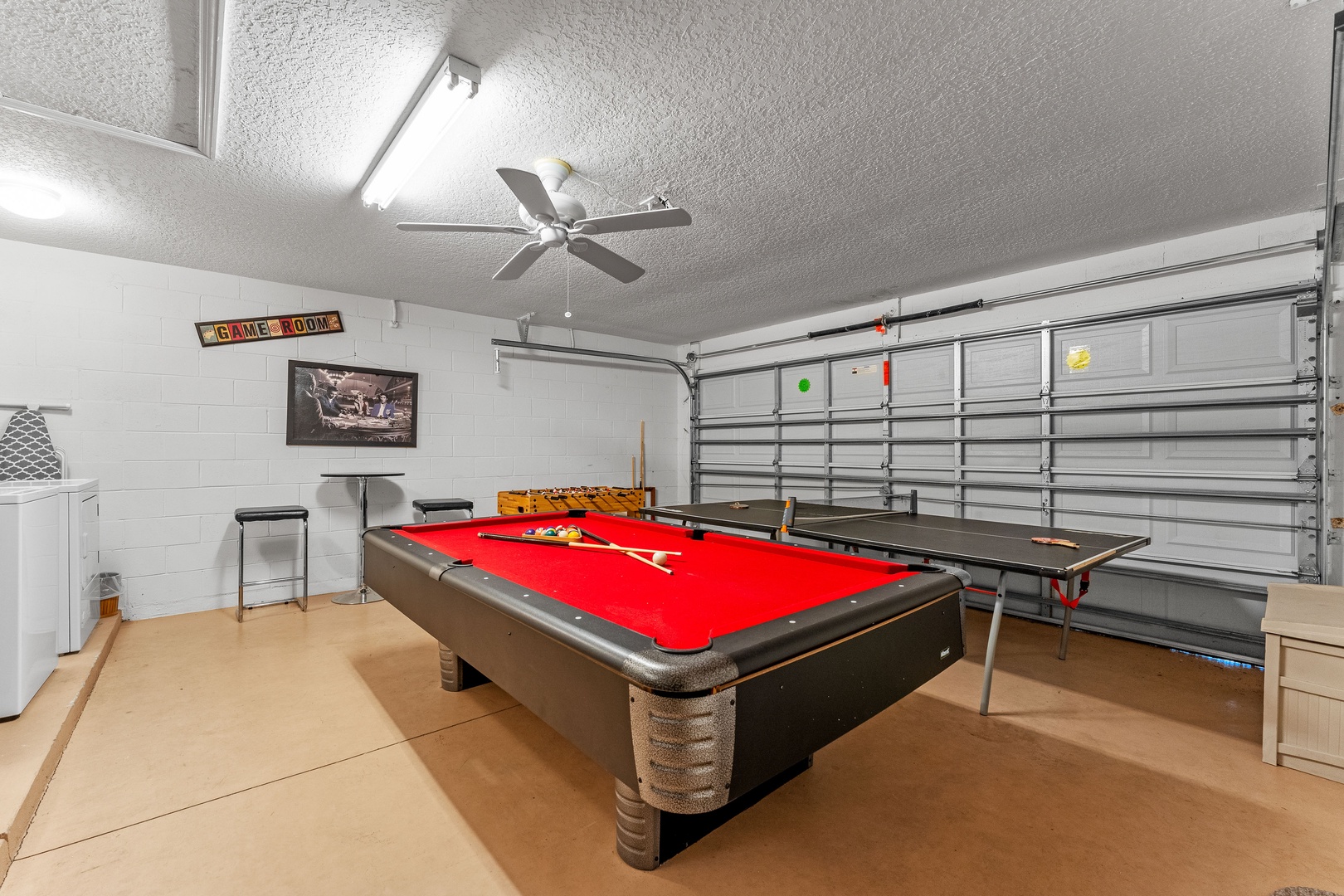 Game room with pool, ping pong, and foosball tables, plus a café table for 2