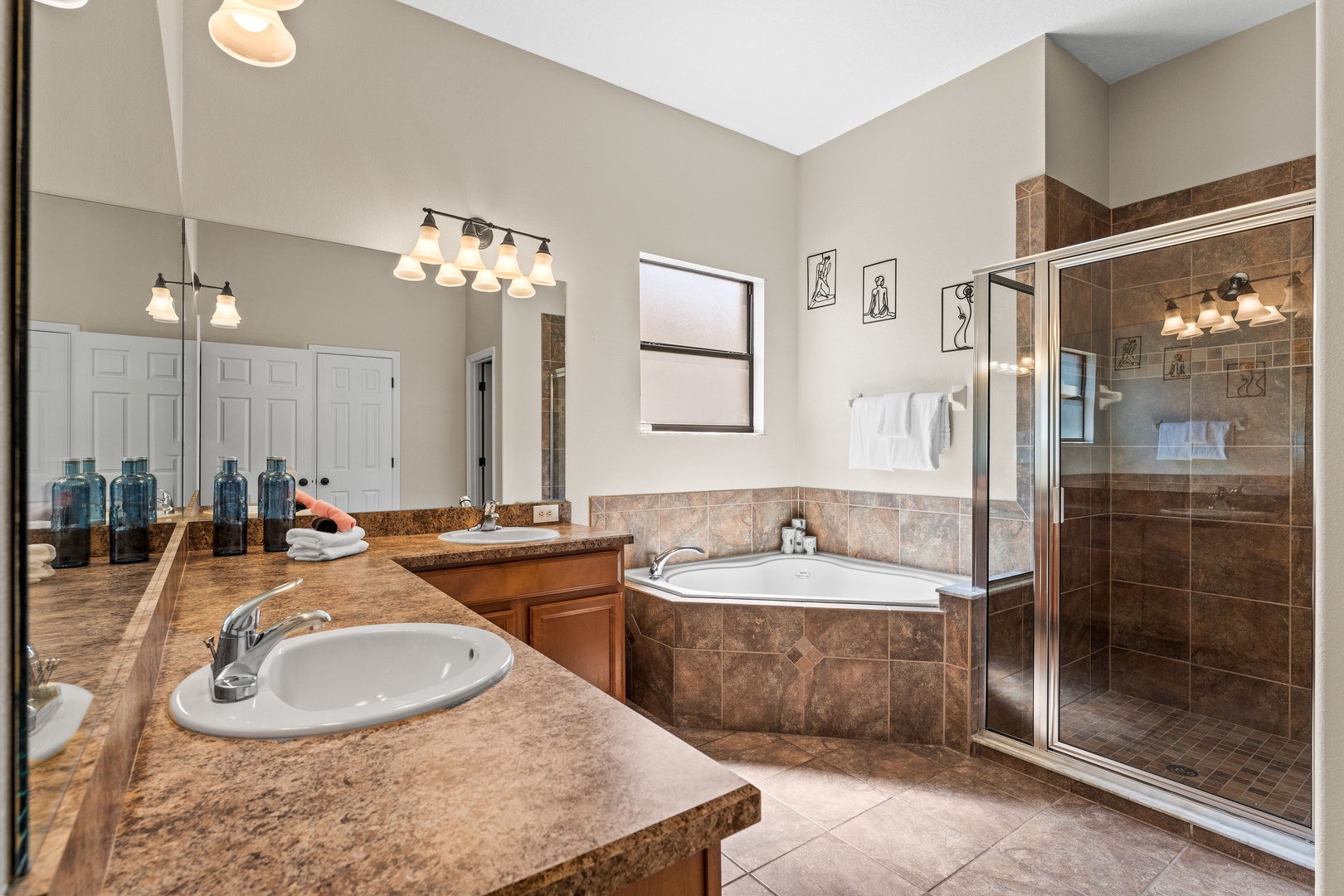 Spacious ensuite with separate soaking tub and glass-enclosed shower