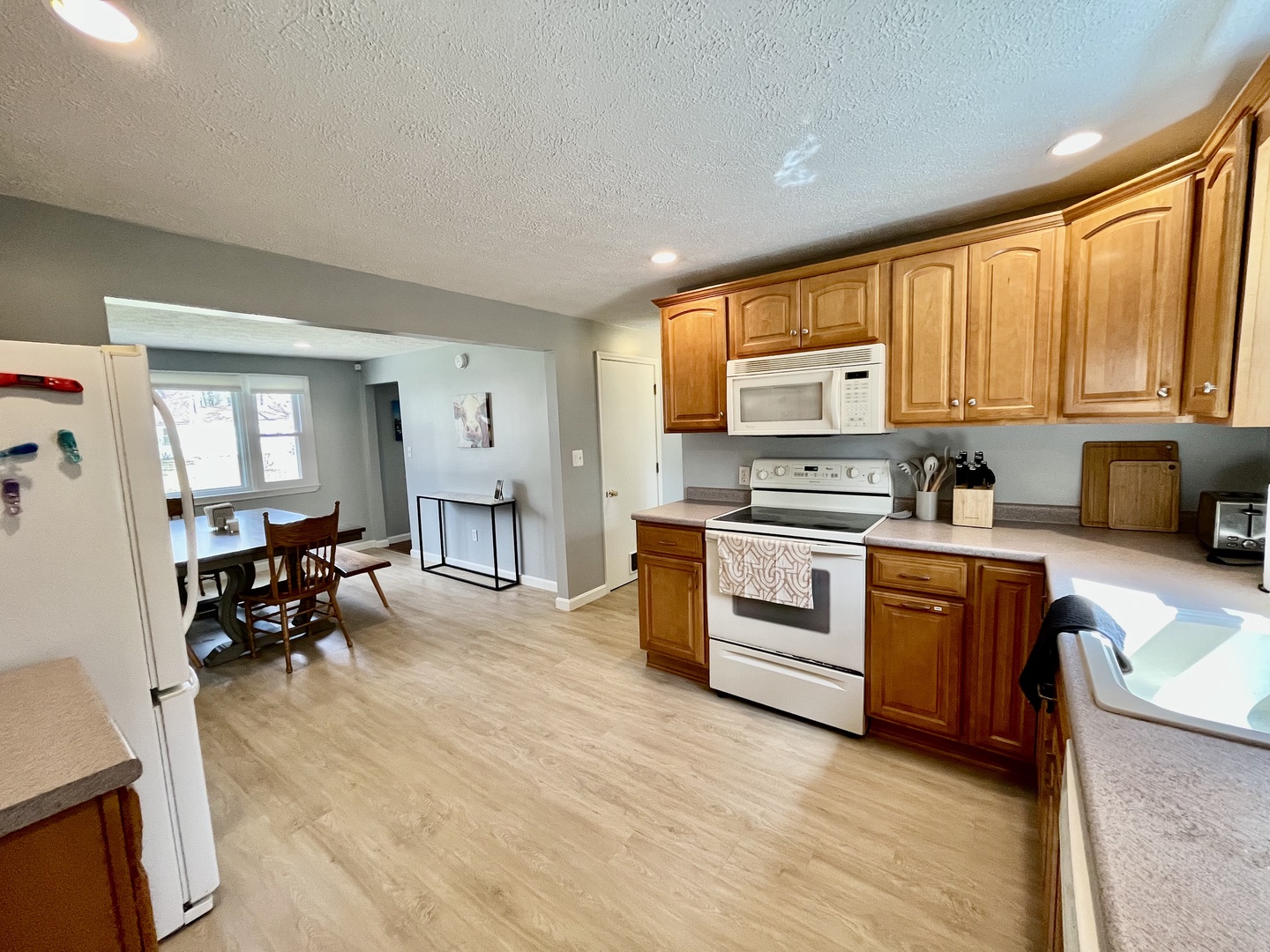 The open, airy kitchen offers ample space & all the comforts of home