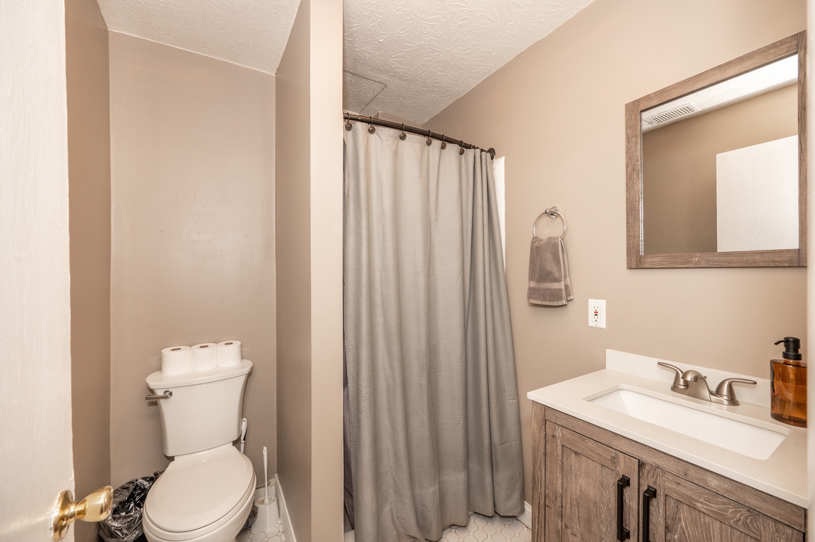 Monmouth Loft 1’s bathroom is nicely tucked away & offers a walk-in shower