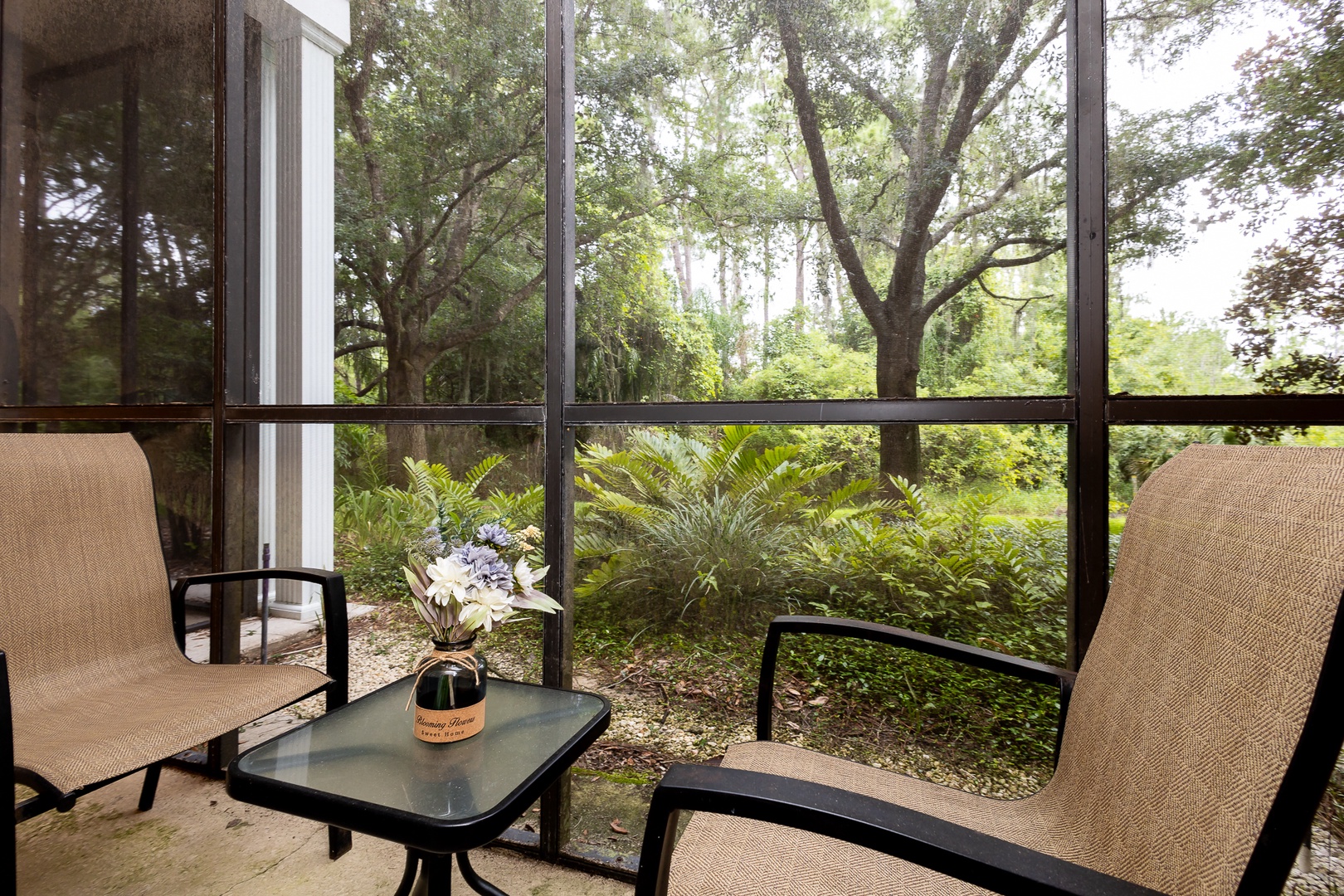 Enjoy the fresh air on the screened patio off of bedroom 2