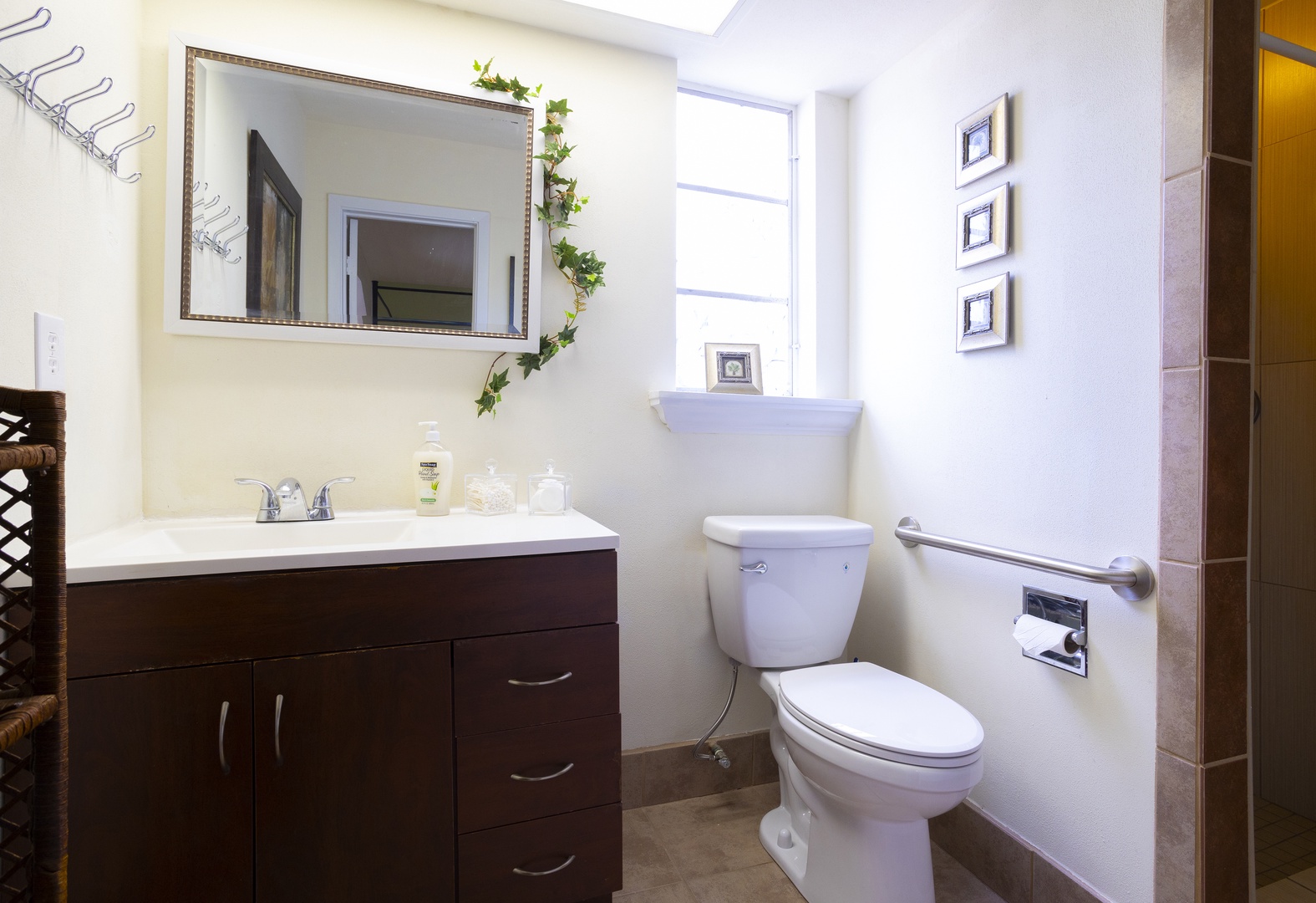 The Jack & Jill bath features a single vanity & walk-in shower