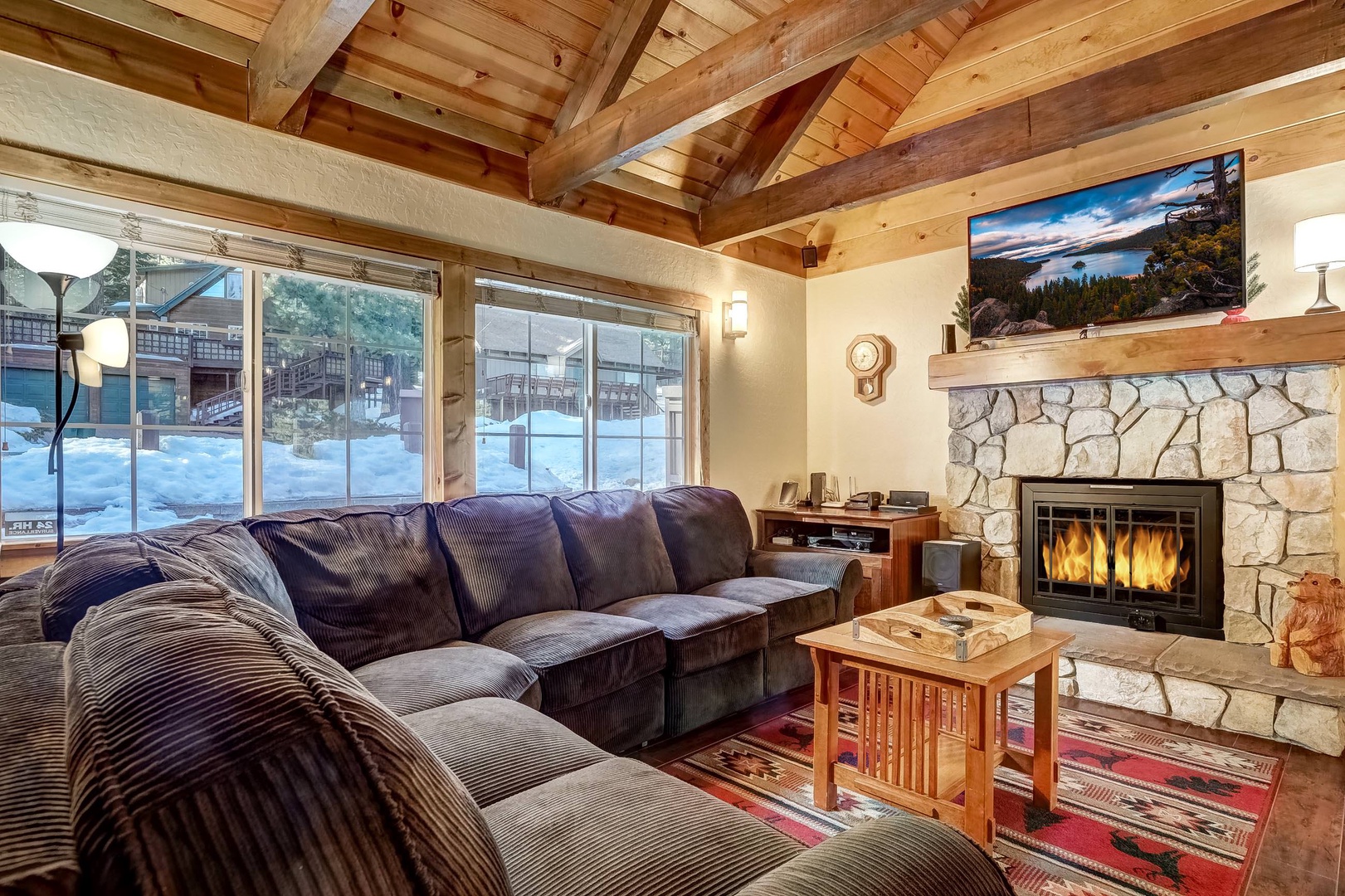 Living room with gas fireplace, Roku Smart TV (with cable), and DVD player