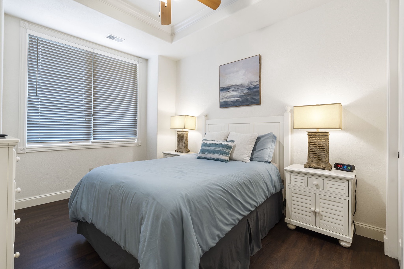 The queen suite offers a private en suite, ceiling fan, & Smart TV
