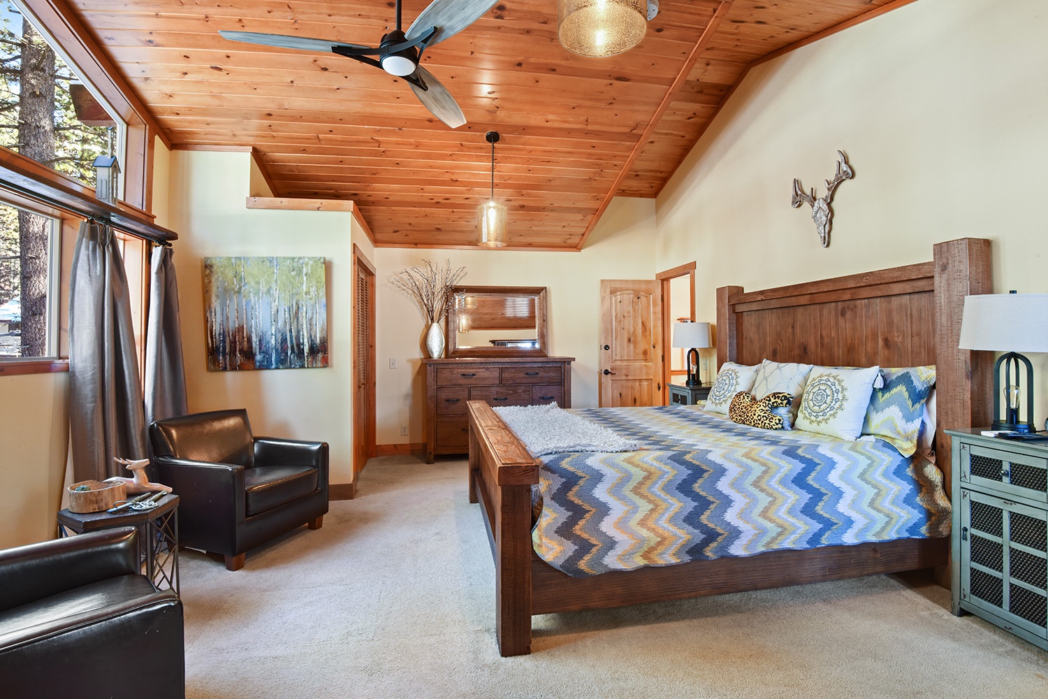 Master bedroom with King bed, TV, and en suite