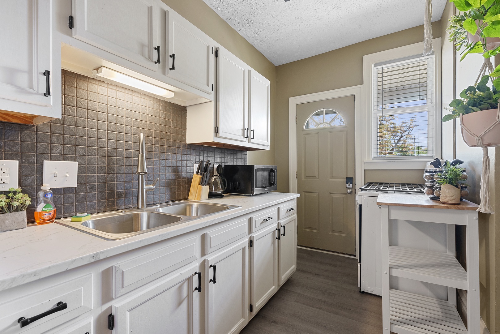 The breezy kitchen offers loads of storage space & every home comfort