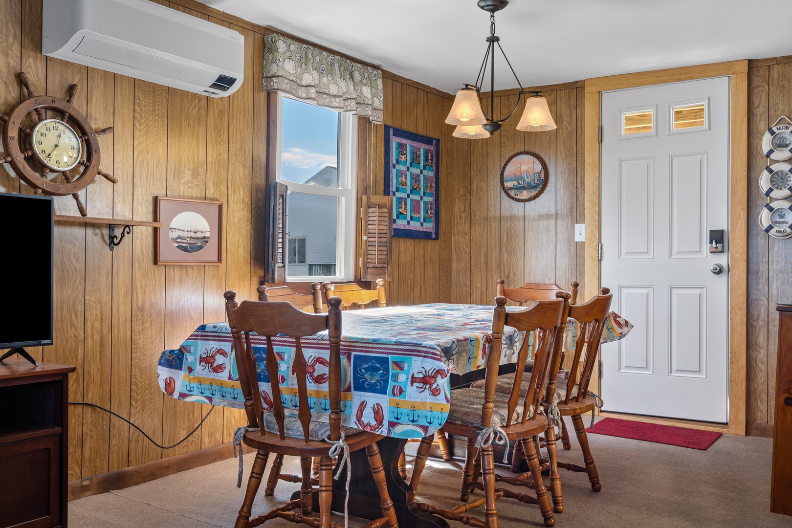 Open living and dining area with dining table for 6