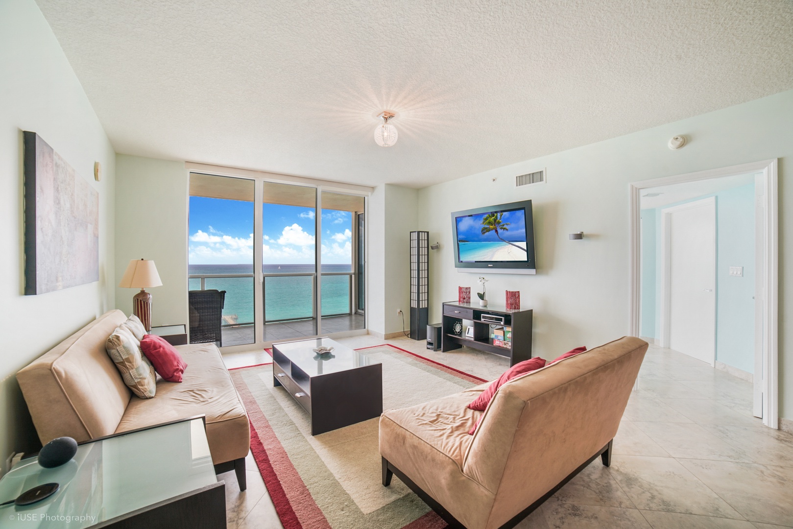Living area with stunning views, ample seating, and TV