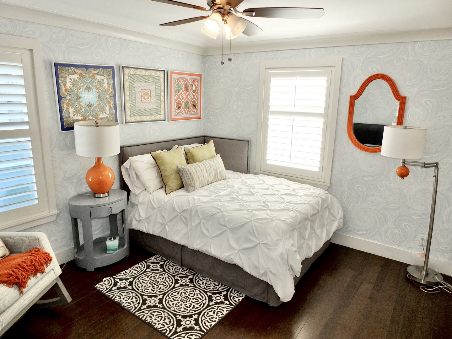 This elegant bedroom features a full-sized bed & Smart TV