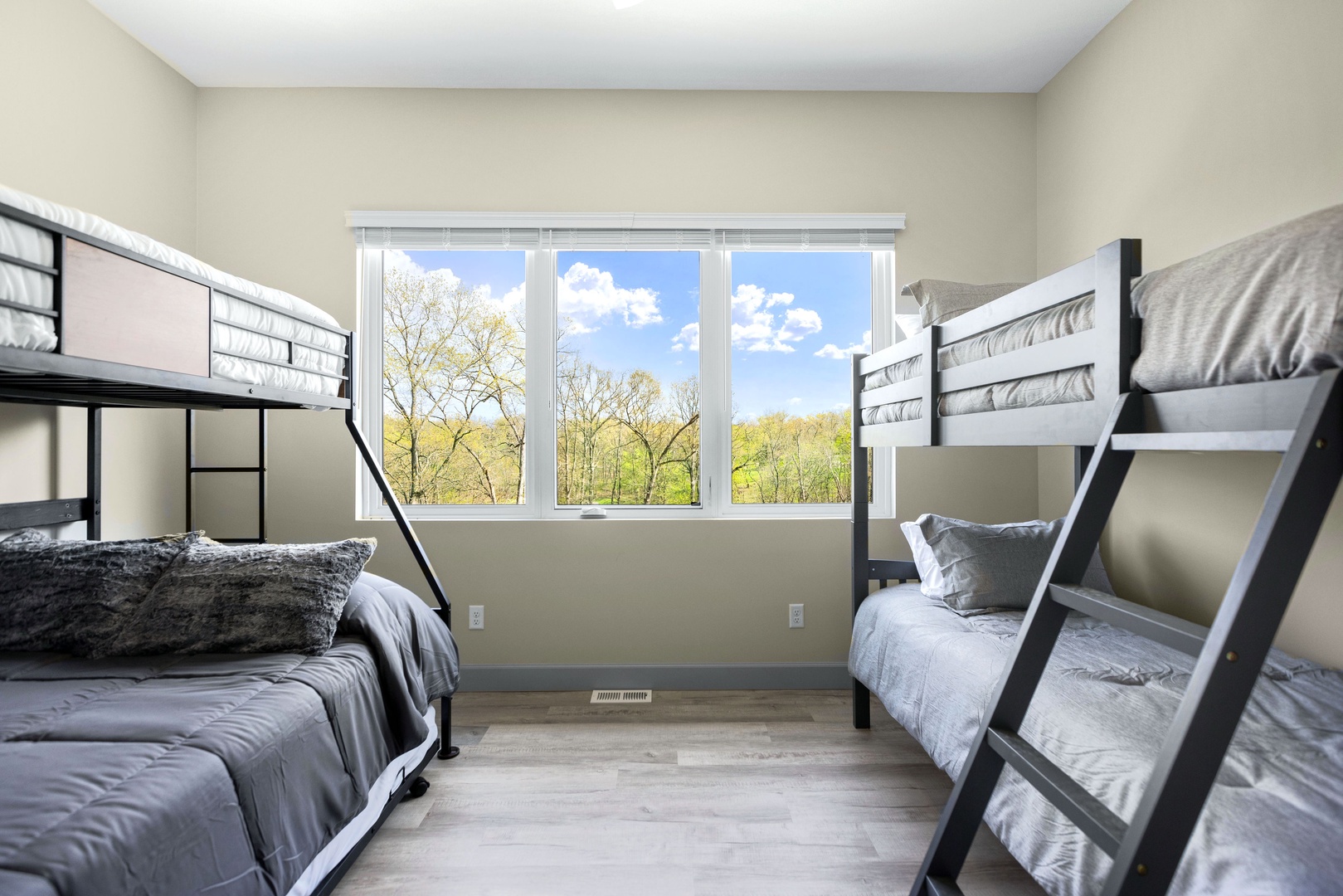 The fourth bedroom features 2 bunk beds and twin trundle