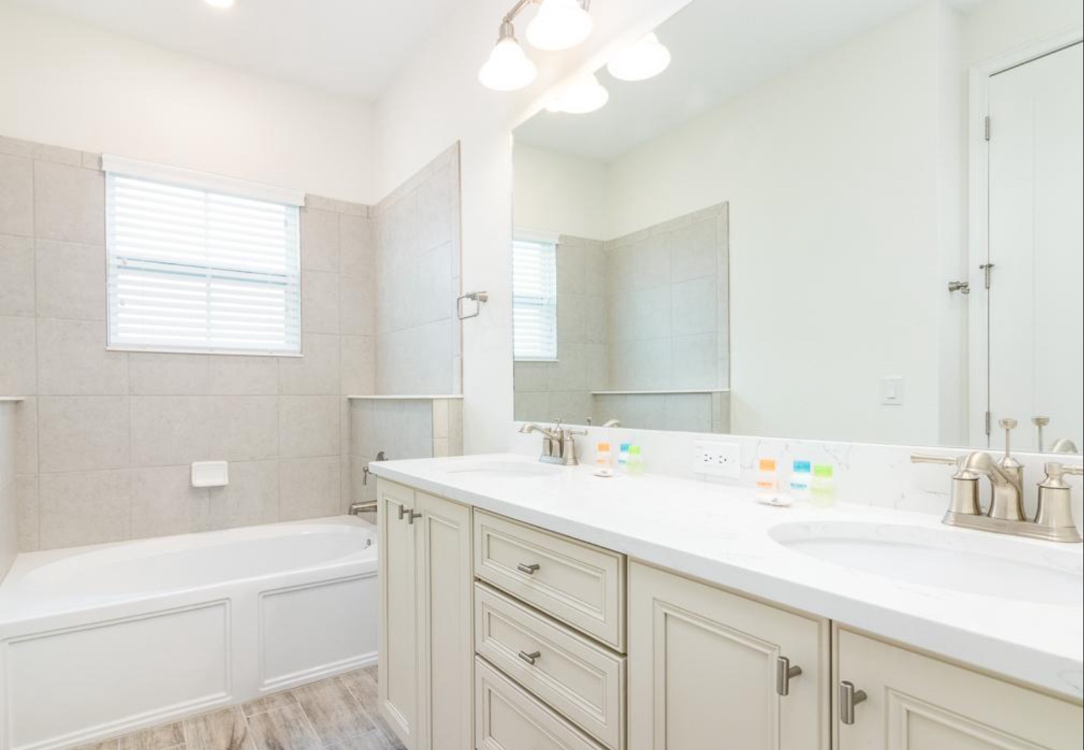 A double vanity & walk-in shower with separate oversize tub ensuite bath