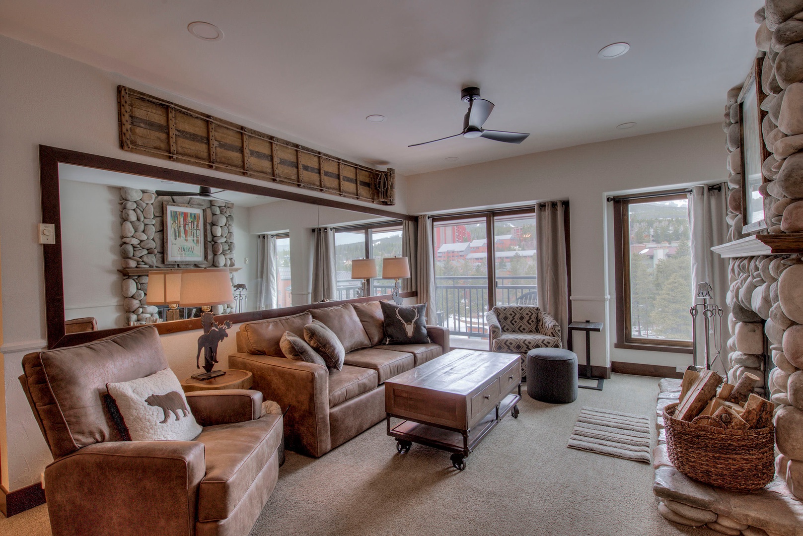 Living room with cable TV, wood fireplace, and a sofa sleeper