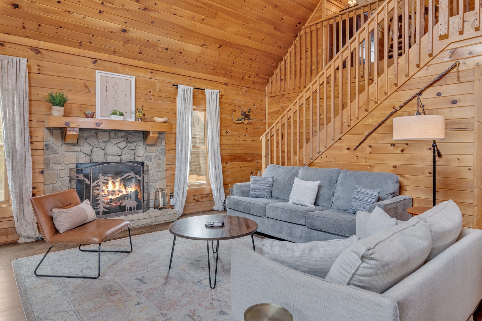 Spacious living area featuring generous seating, a Smart TV, and a cozy fireplace