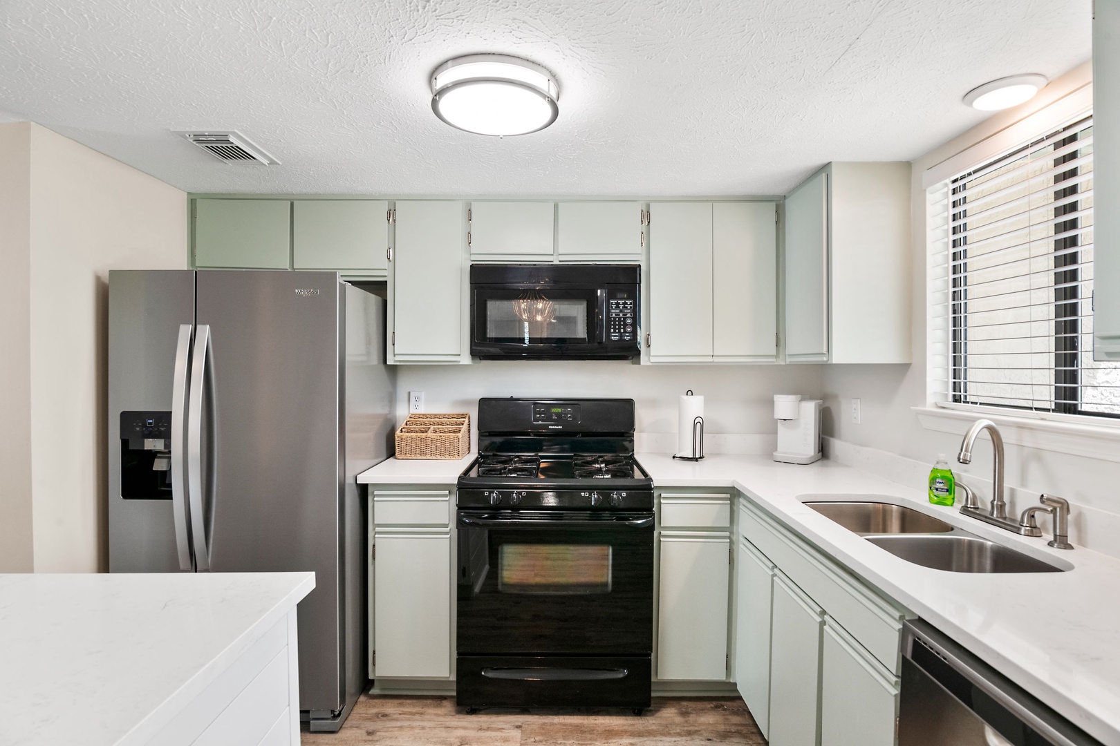 The open, airy kitchen offers ample space & all the comforts of home