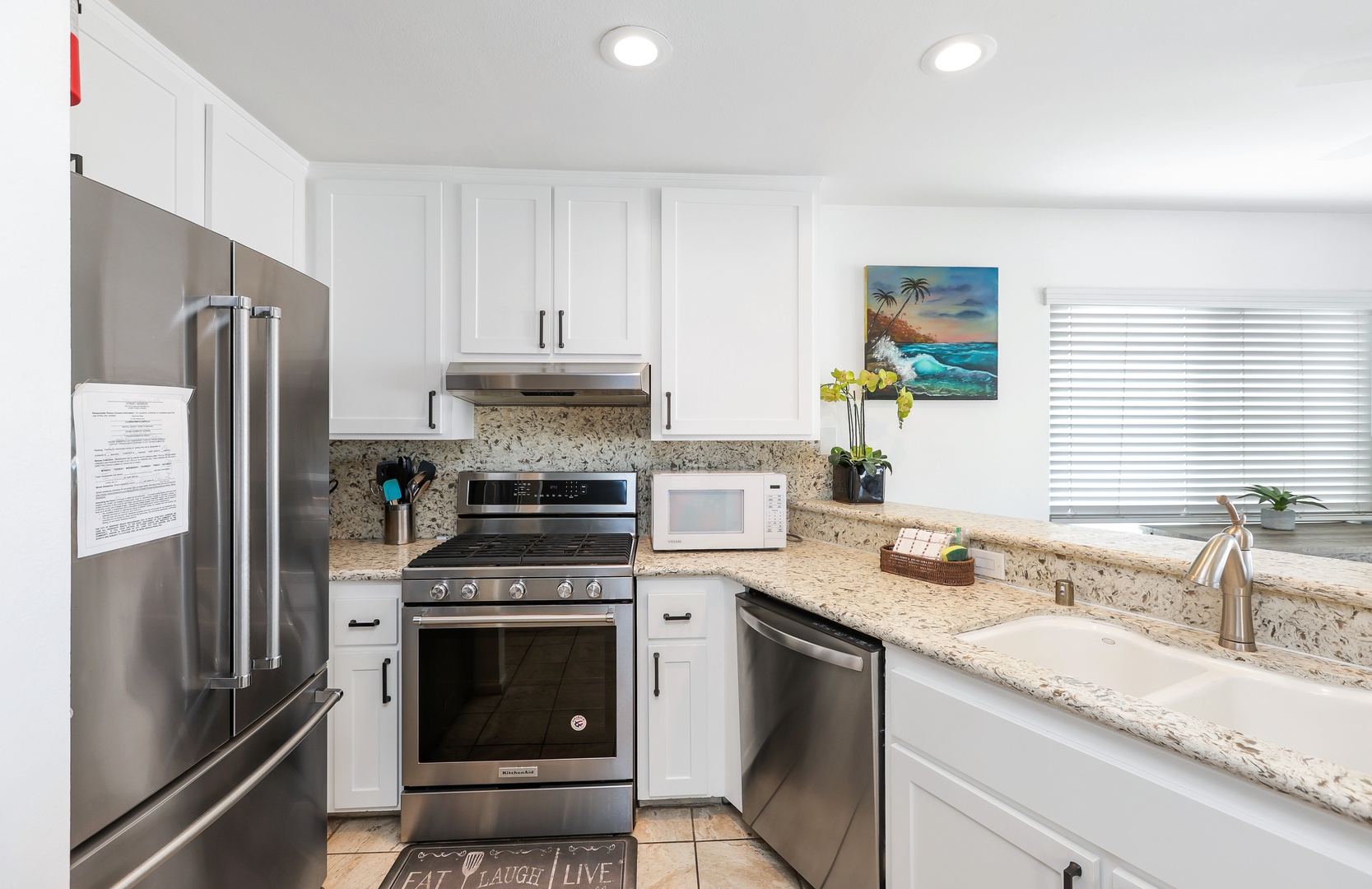 The open, airy kitchen offers ample space & all the comforts of home