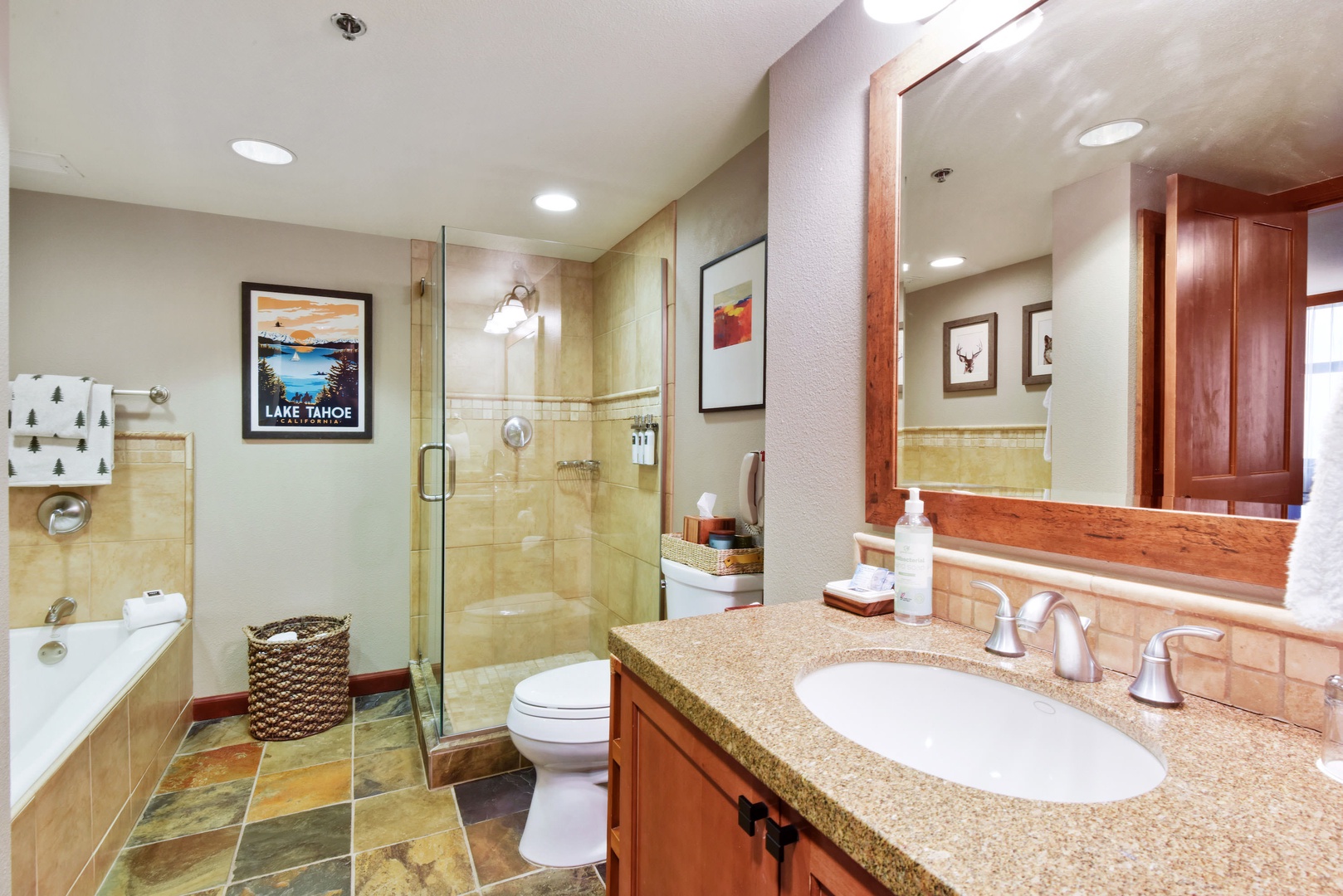 En suite bathroom with standing shower and soaking bathtub