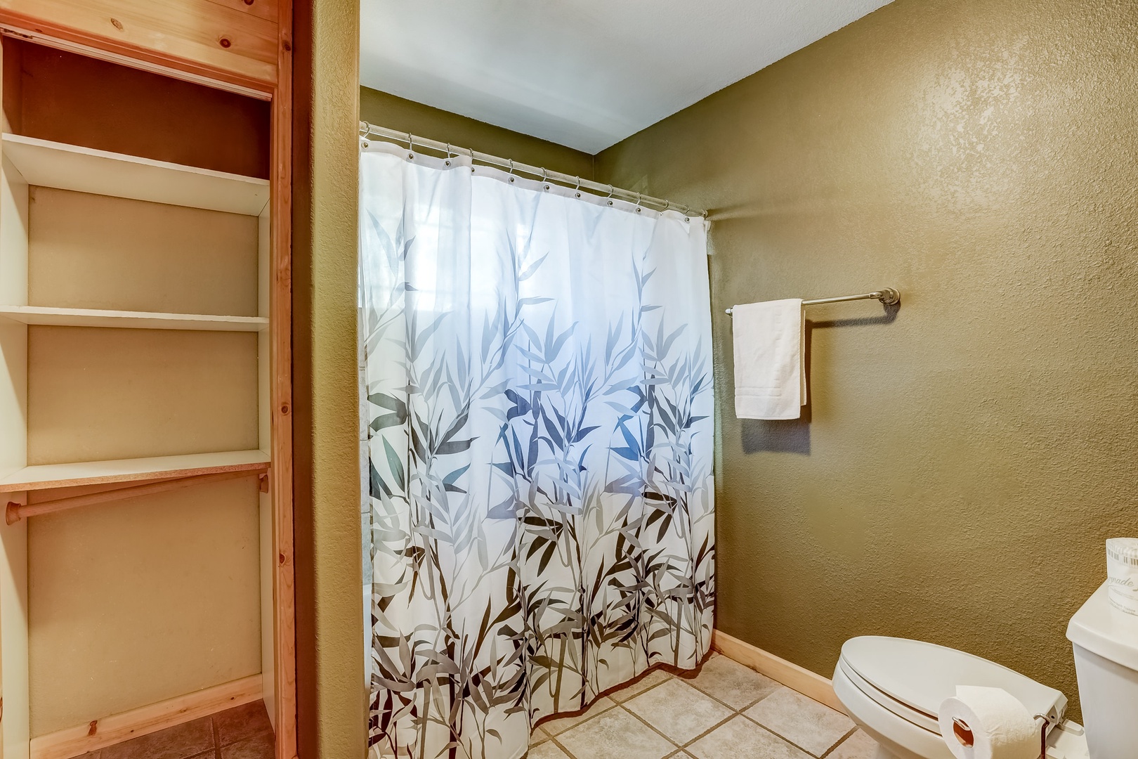 Full bathroom by hallway/game room