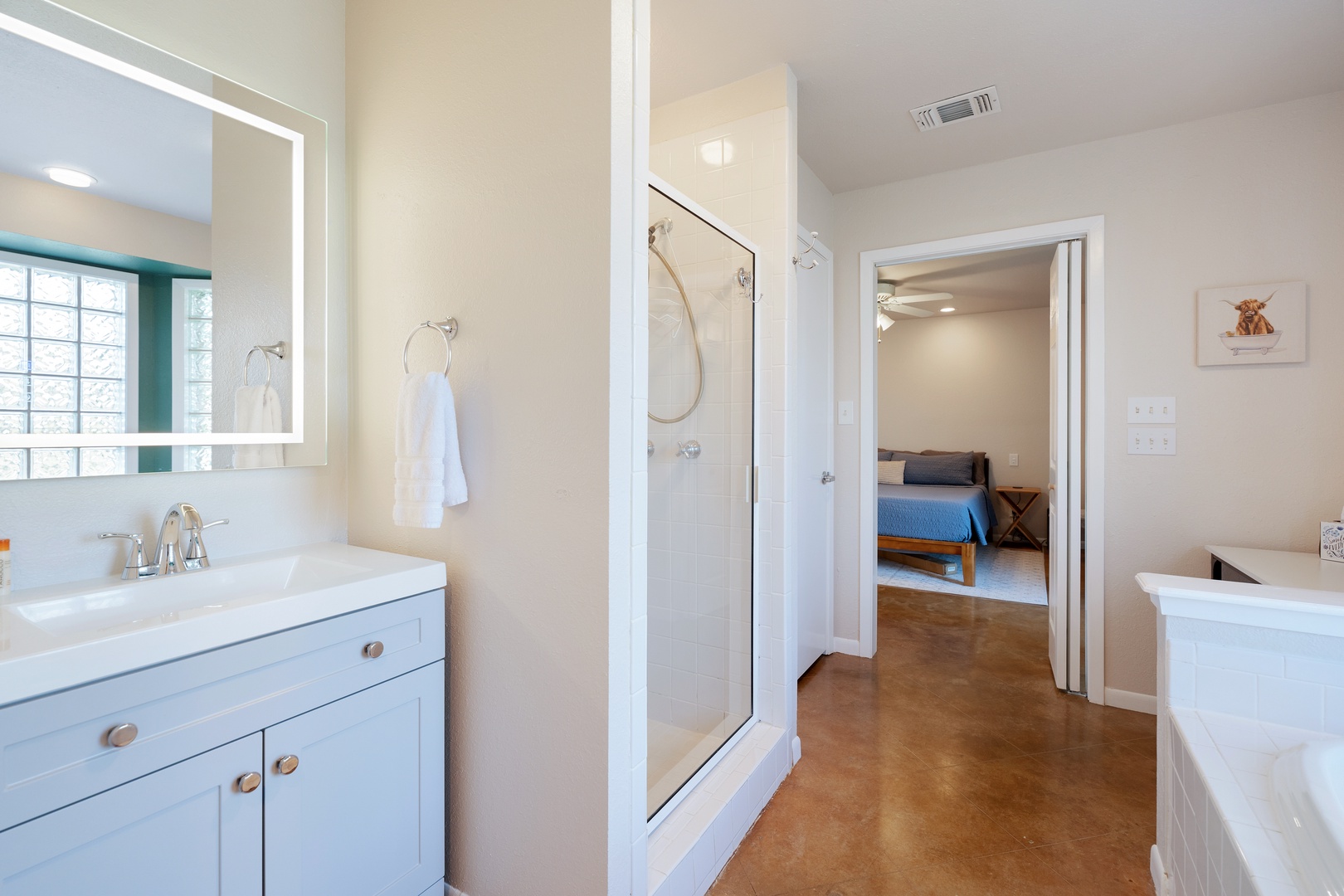 The main house king en suite boasts a jetted soaking tub and glass shower