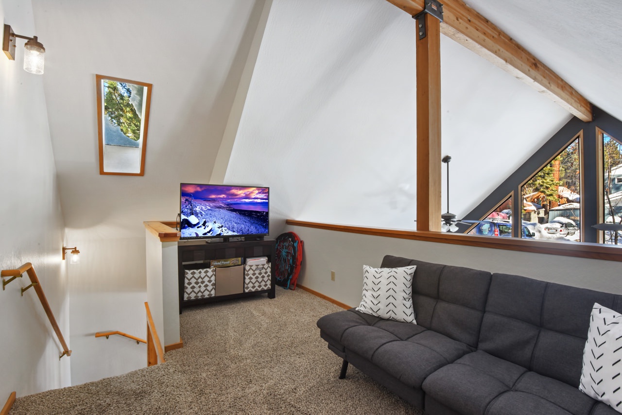 Loft space with futon and TV