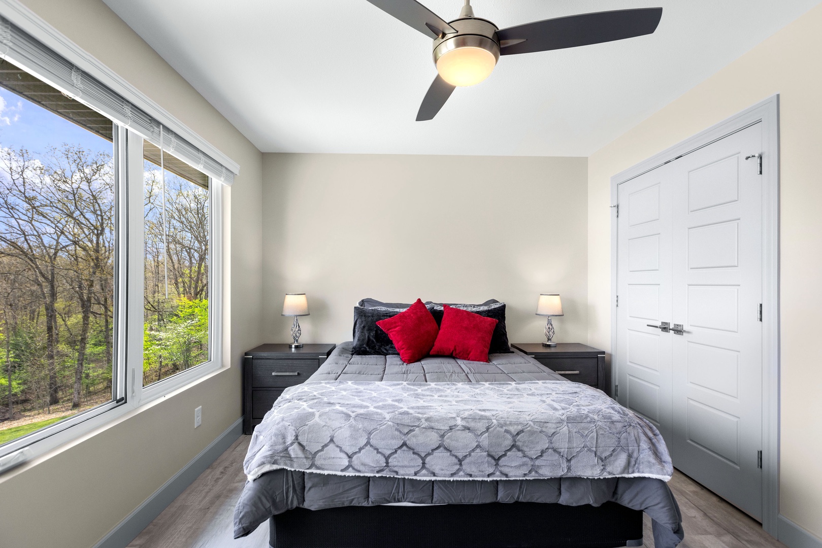 Unwind in the third bedroom furnished with queen bed and nature vistas