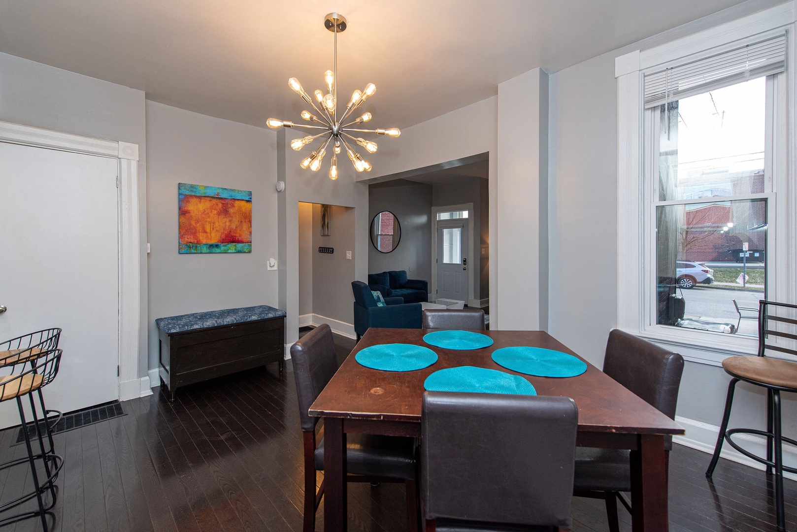 The chic dining room offers combined table & counter seating for a total of 6