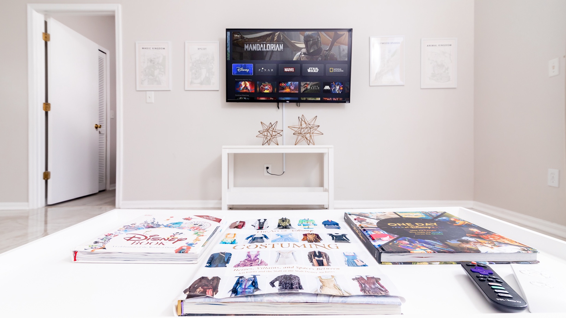 Living room has SmartTV and plenty of Disney themed items