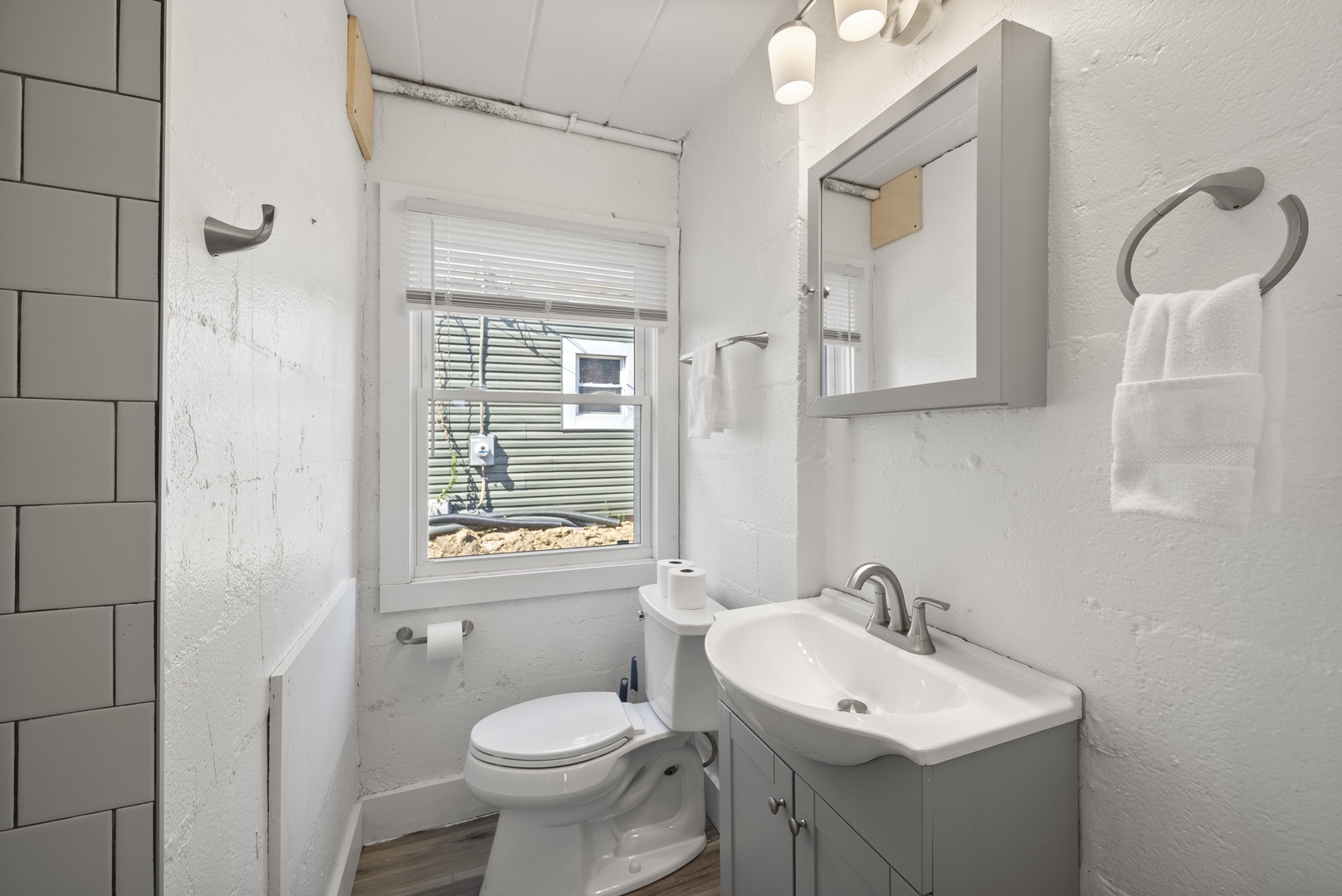 Refresh in the full bath, featuring a single vanity & tiled shower