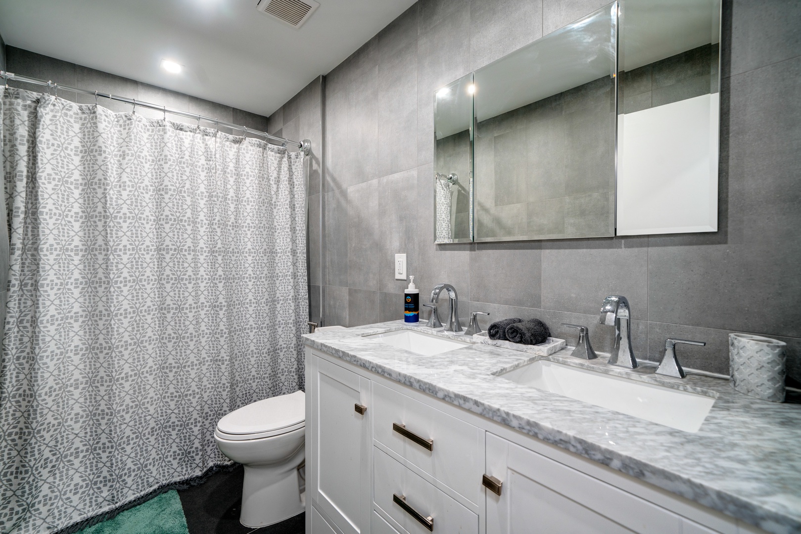 Prepare for the day in this 1st-floor full bath, with a shower/tub combo