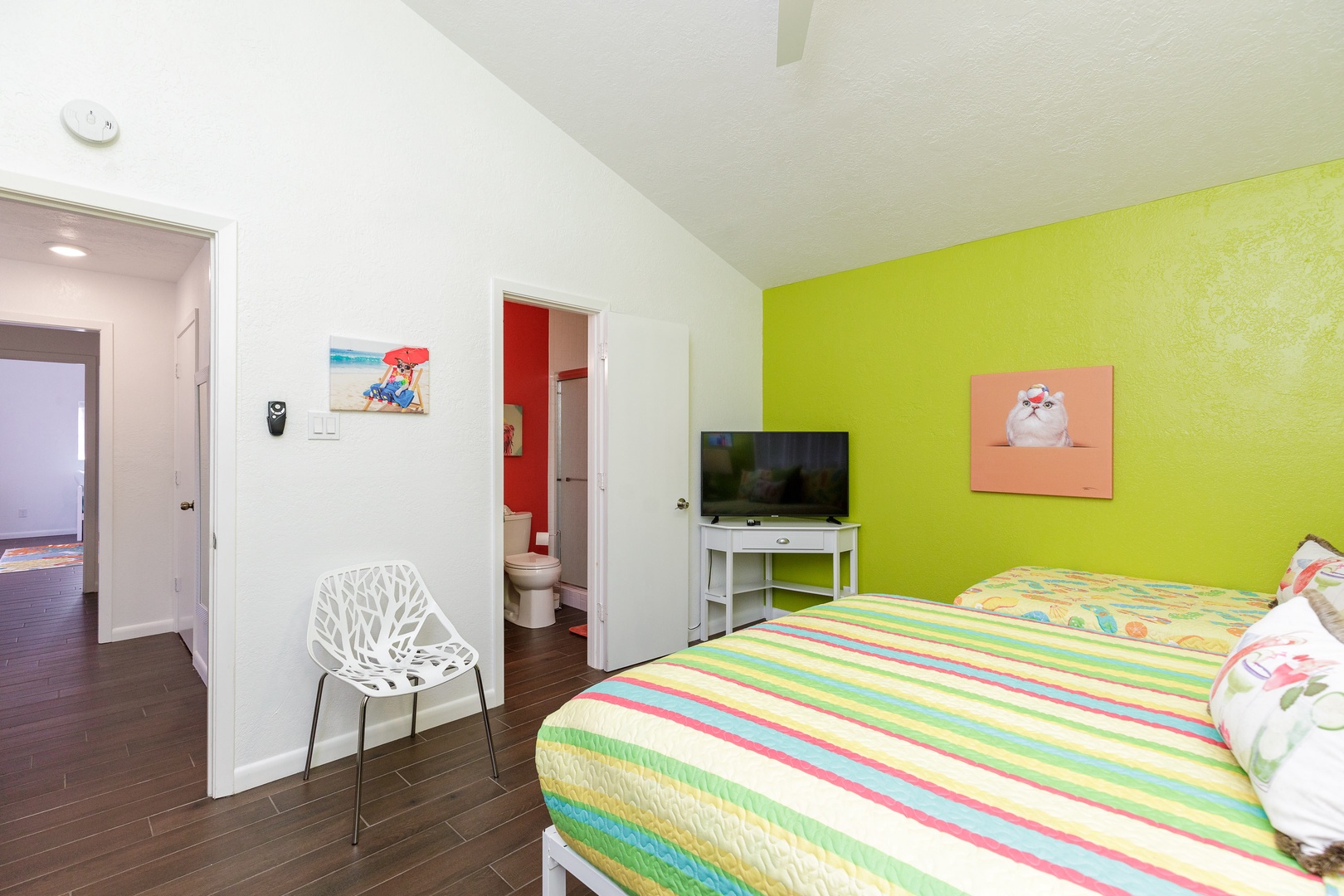 The second suite includes a queen & twin bed, en suite bath, & Smart TV