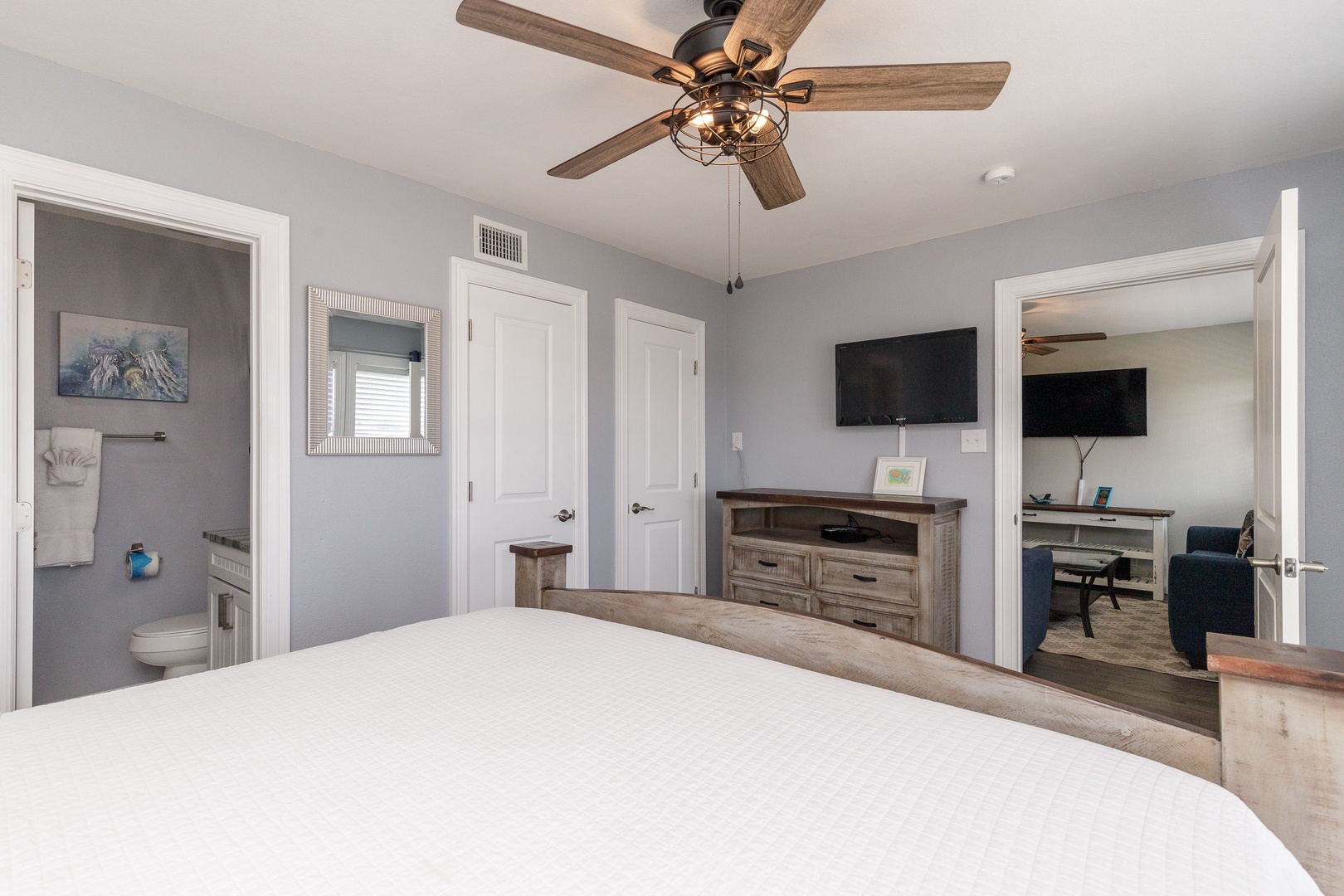 This king suite boasts a private en suite, Smart TV, & ceiling fan