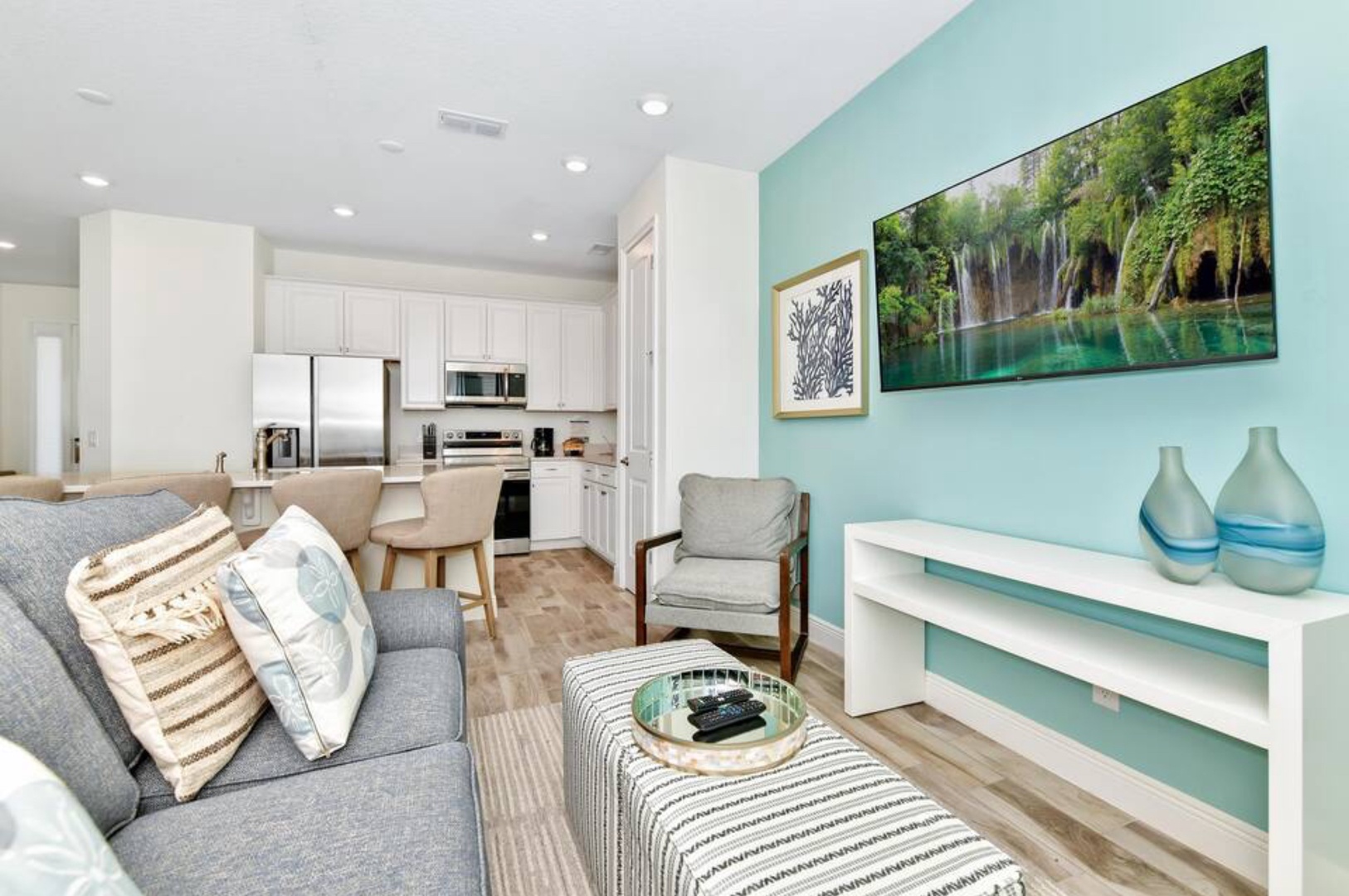 Relax in this bright and airy living space with modern amenities and coastal decor