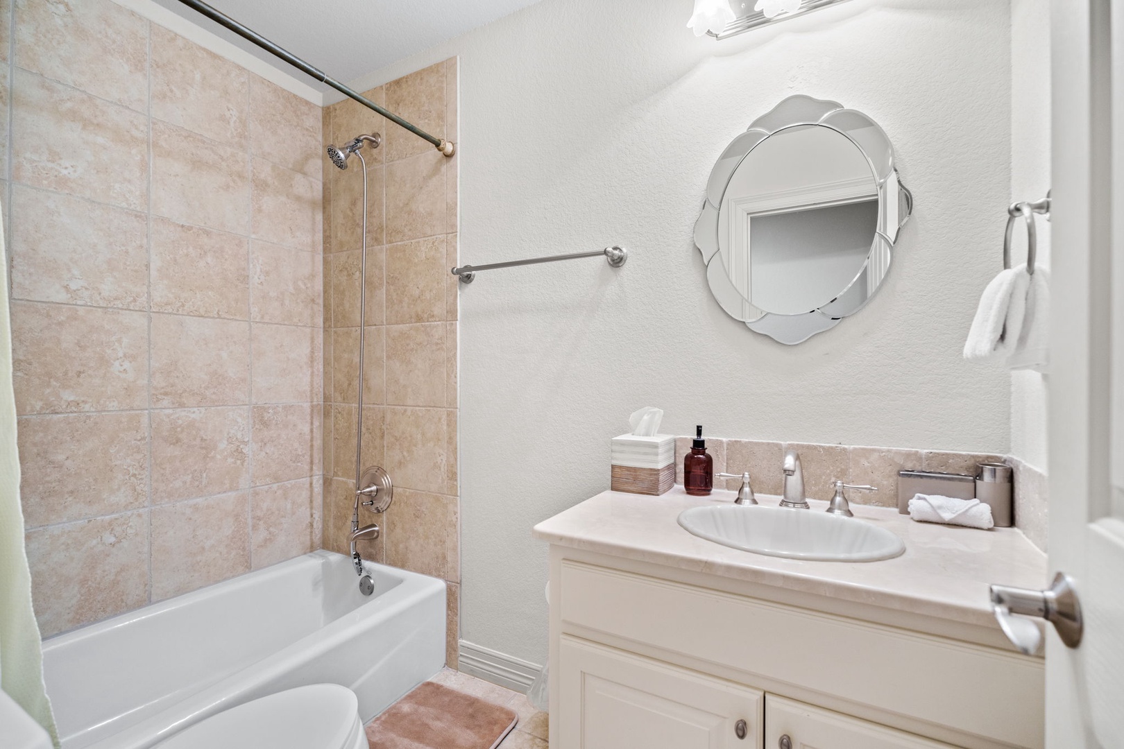 This full bath on the 2nd floor offers a single vanity & shower/tub combo