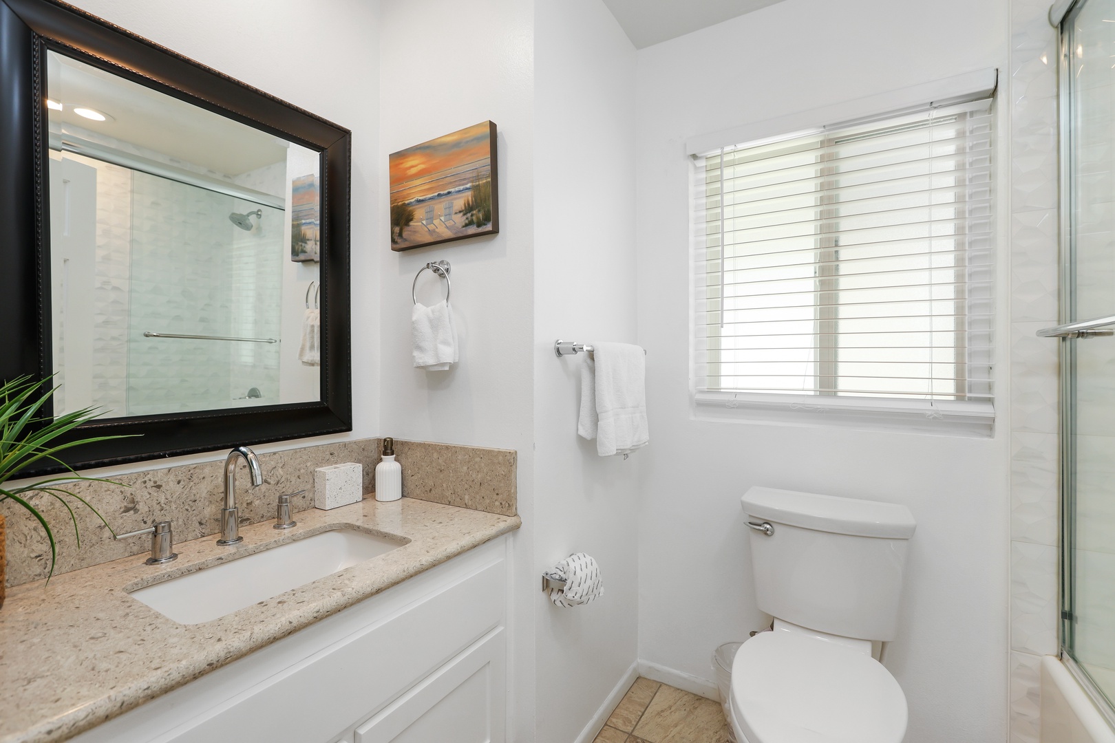 A single vanity & shower/tub combo await in the hall bath