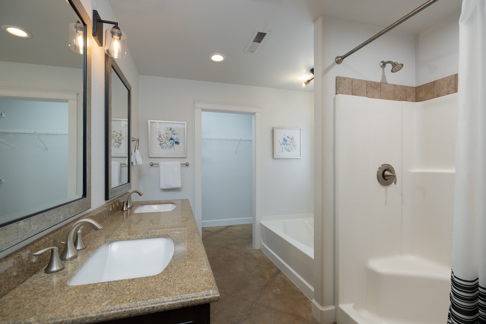 The king ensuite offers a dual vanity, shower, & soaking tub