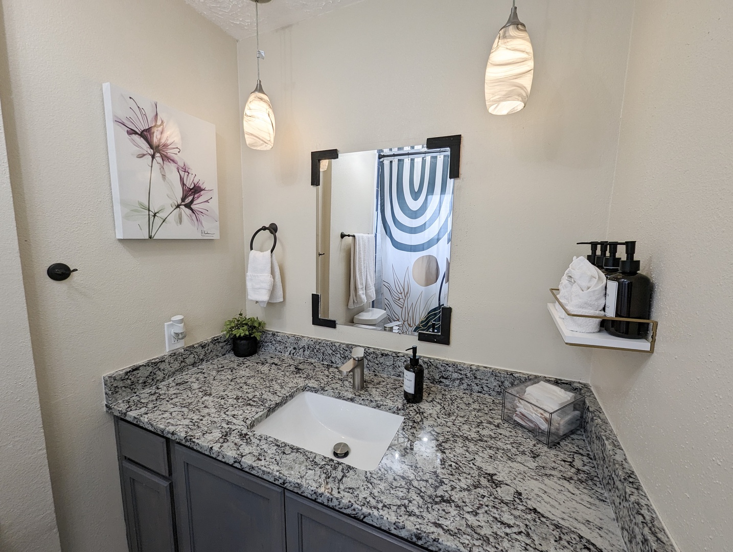 A large vanity & shower/tub combo await in the master ensuite