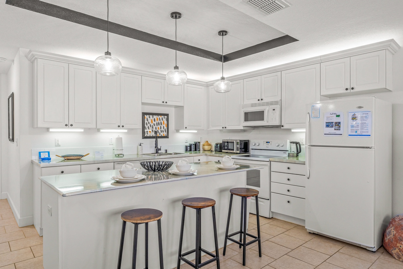 Sip morning coffee or grab a bite at the kitchen counter, with seating for 3
