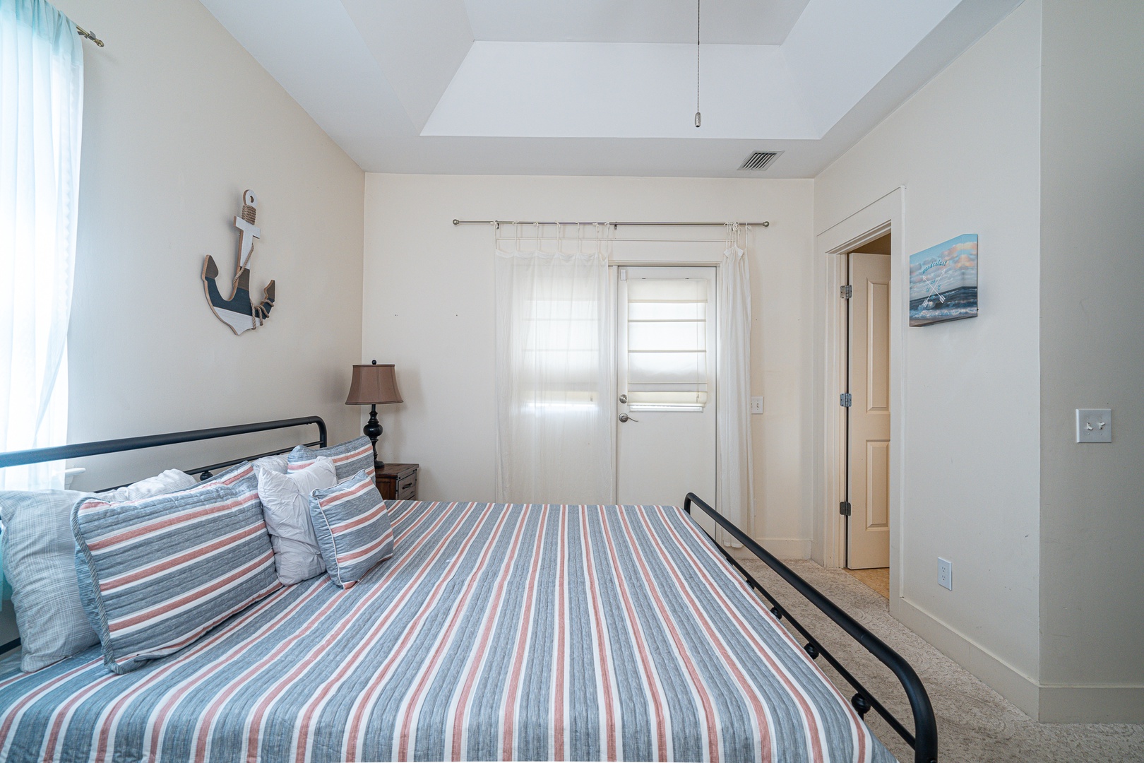 The 2nd floor king suite boasts a private ensuite, Smart TV, & balcony access