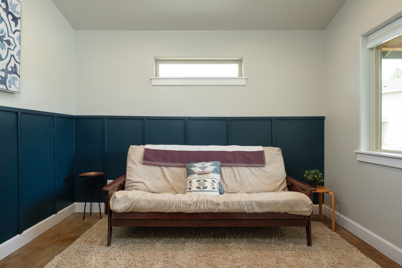 Comfort and versatility awaits in this sitting room, with a full-sized futon