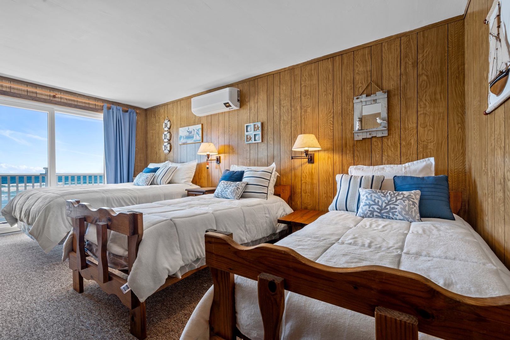 Bedroom 2 with queen bed, 2 Twin beds, and balcony access