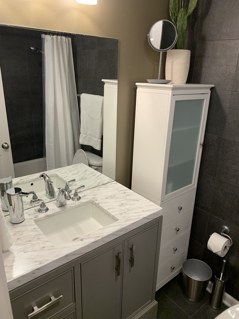 Full bathroom with shower, and tub