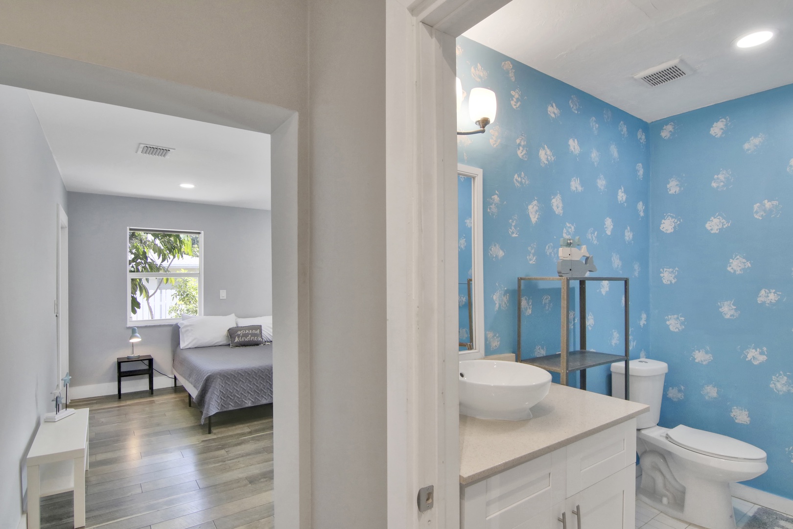 The ensuite bathroom includes a single vanity & shower/tub combo