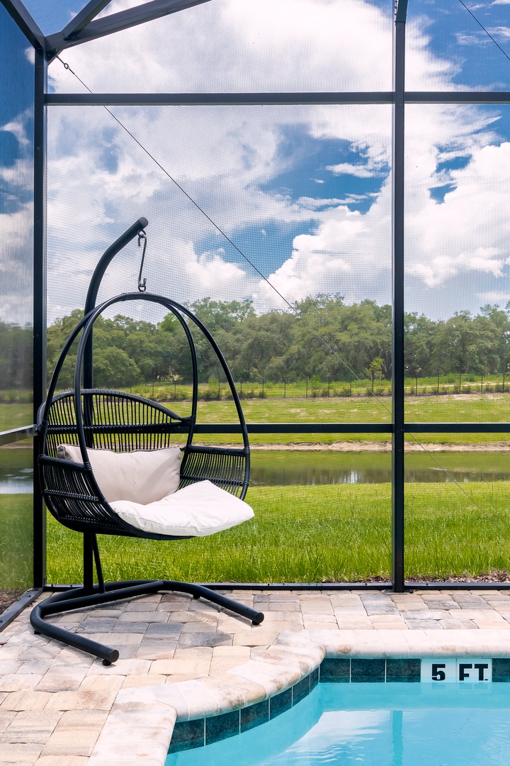 Bring your favorite book and drink poolside in the hammock style chair