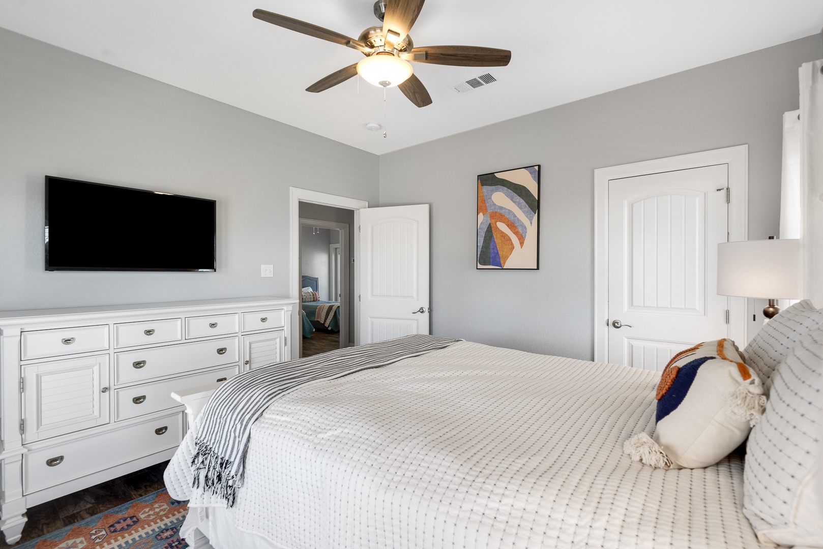 The 2nd Floor Queen Bedroom offers Deck Access and a private Smart TV