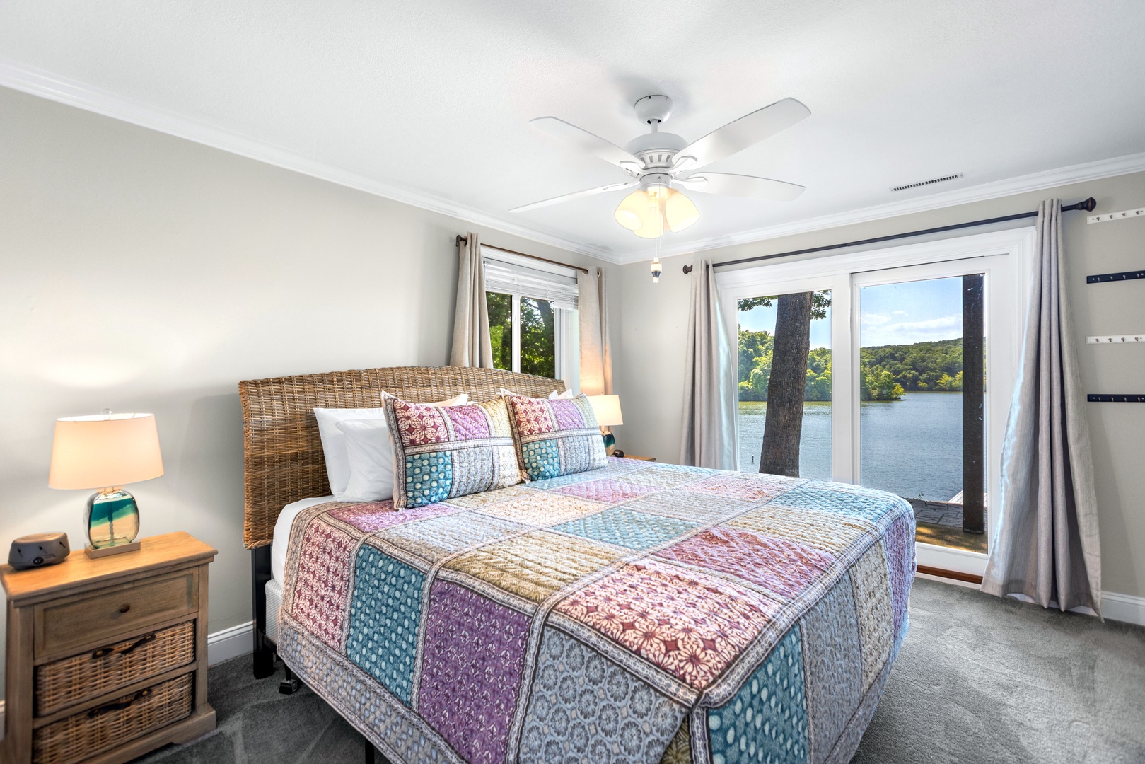 The lower-level suite boasts a king bed, ensuite bath & patio access