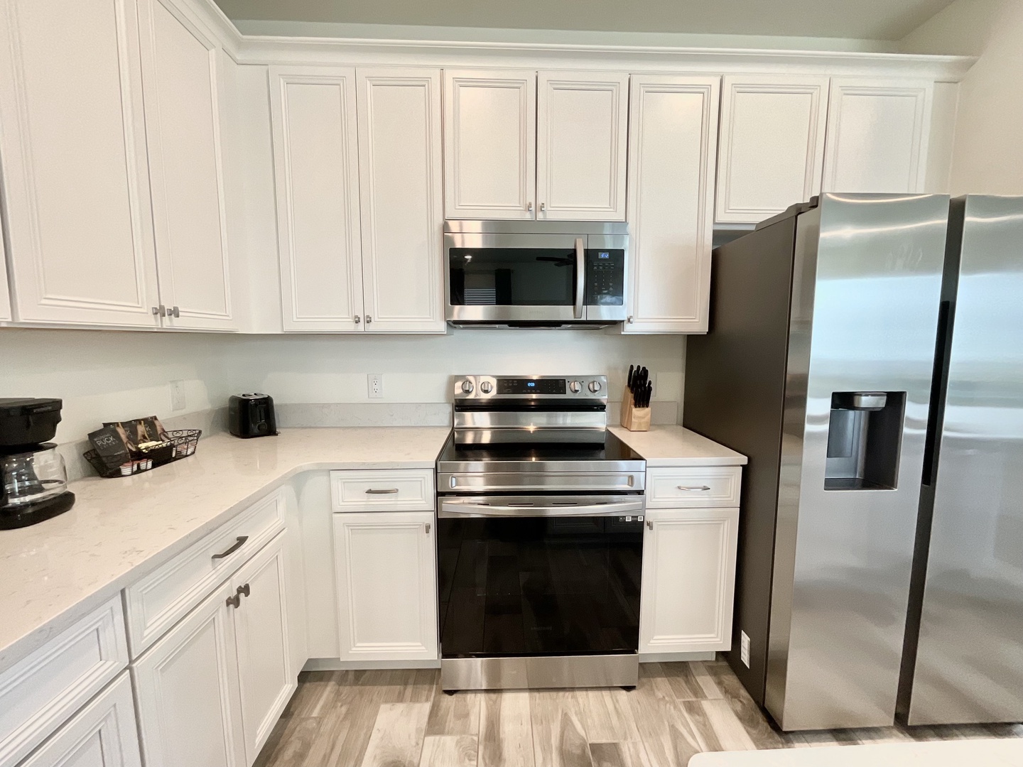 The open, airy kitchen offers ample space & all the comforts of home