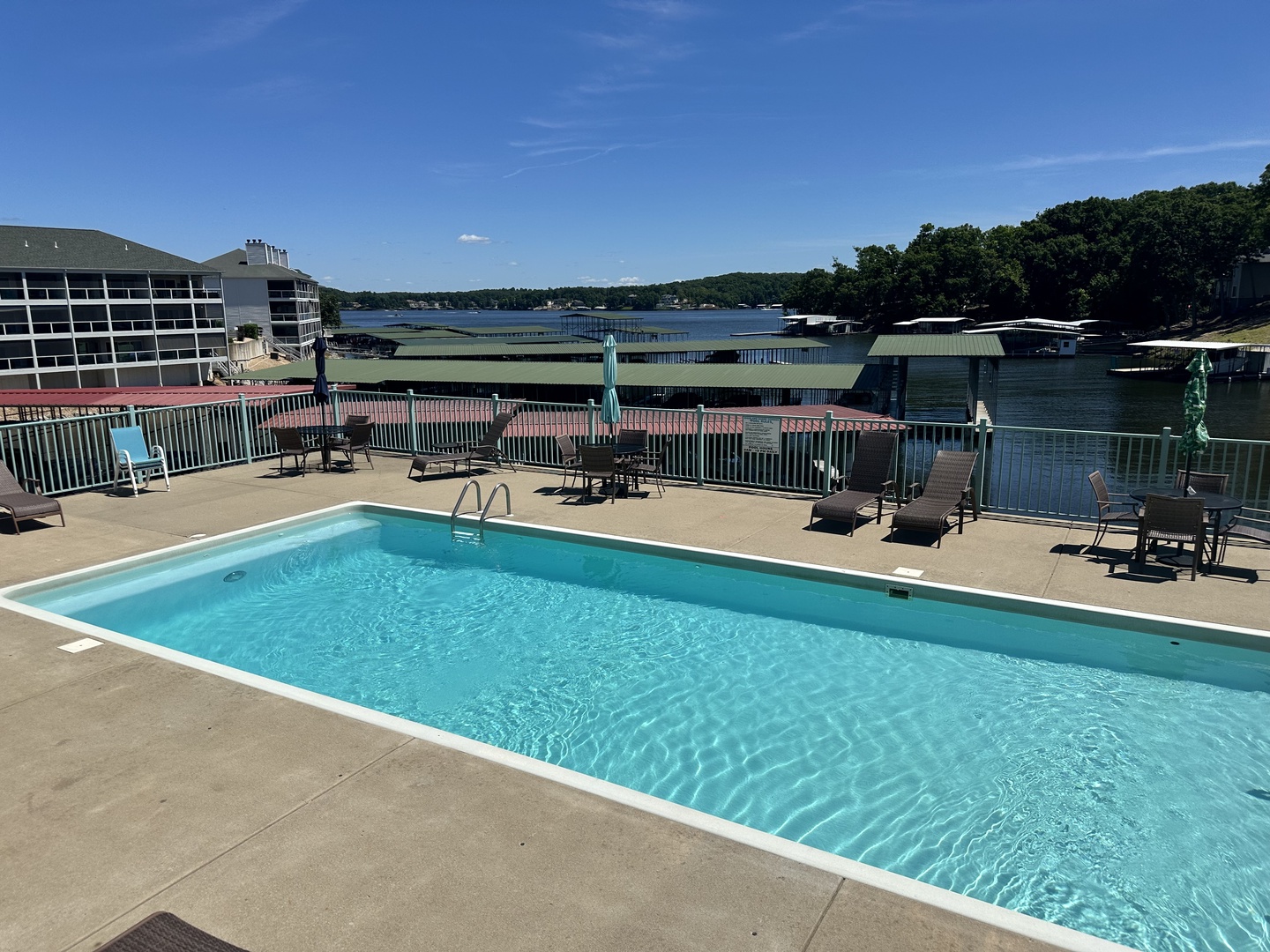 Dive into the pool with a front-row view of the serene lake